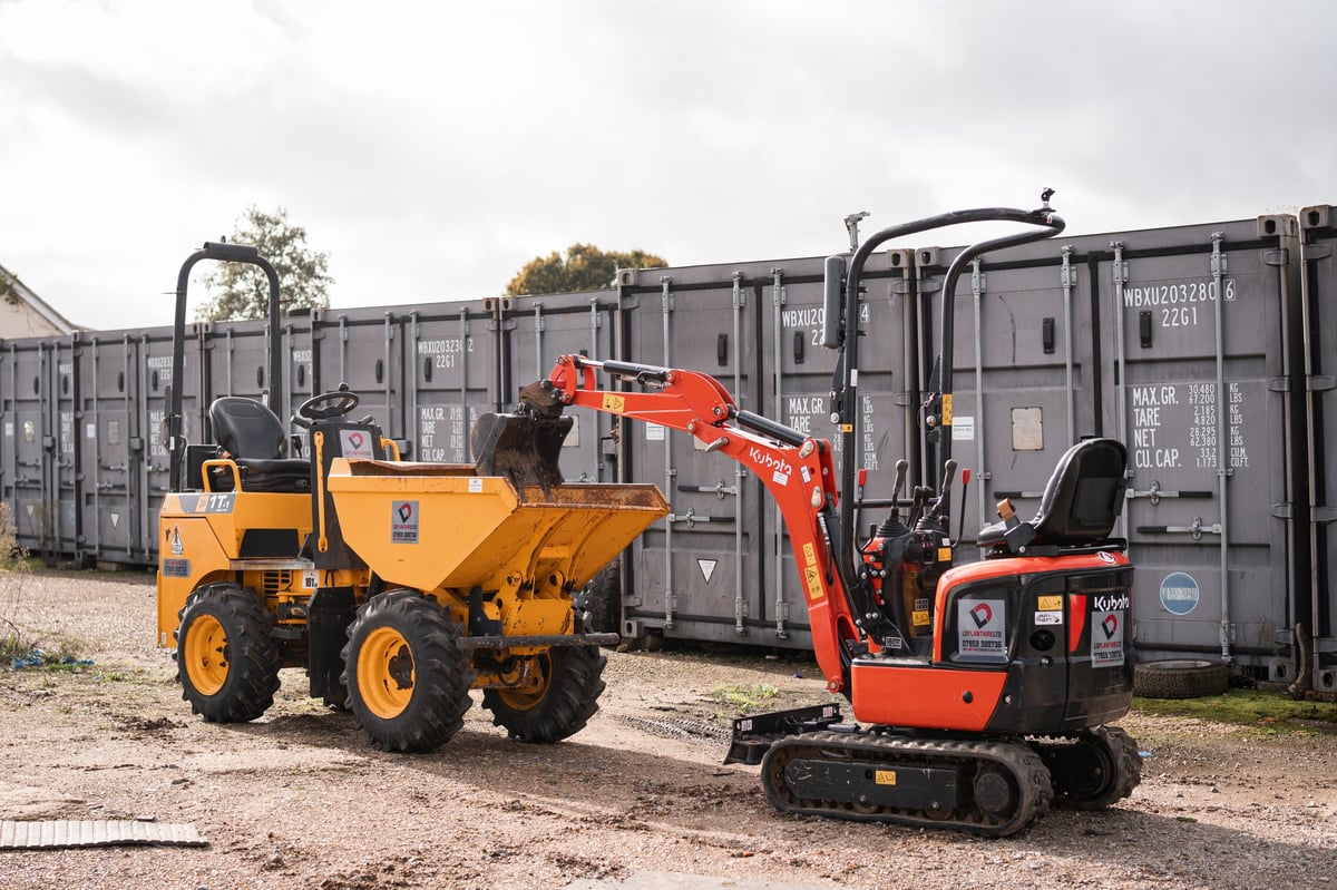 Yellow dumper and red Kubota mini excavator at the LD Plant Hire yard